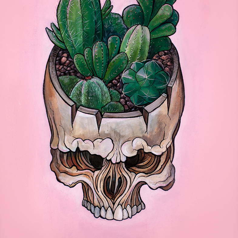 graphical skull with assorted cacti planted inside the upper half of the skull set against a pale pink background